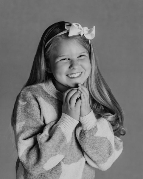 black and white school portrait of a girl with a white bow, Colorado