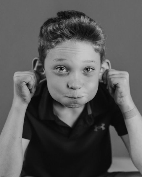 playful black and white school portrait of a boy, Denver Colorado