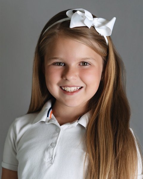 school picture day portrait of a girl in a white polo, Denver