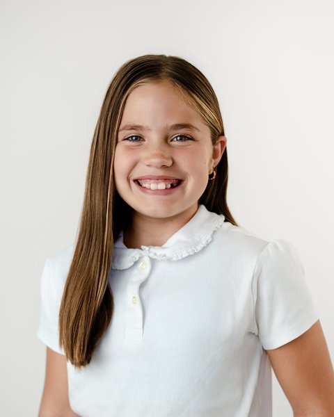 school portrait of a girl in a white collared polo, Denver Colorado